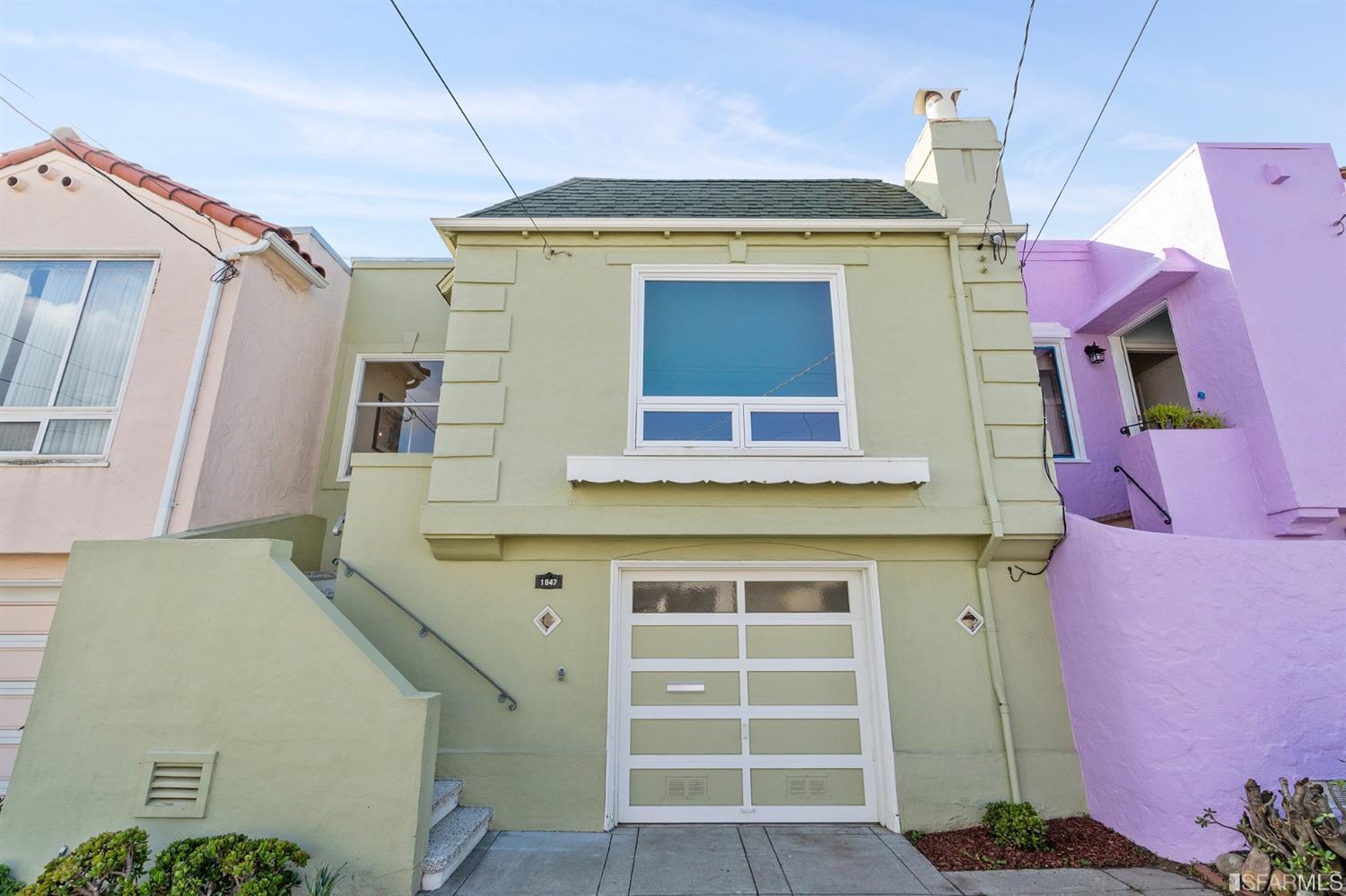 a front view of a house with a garage