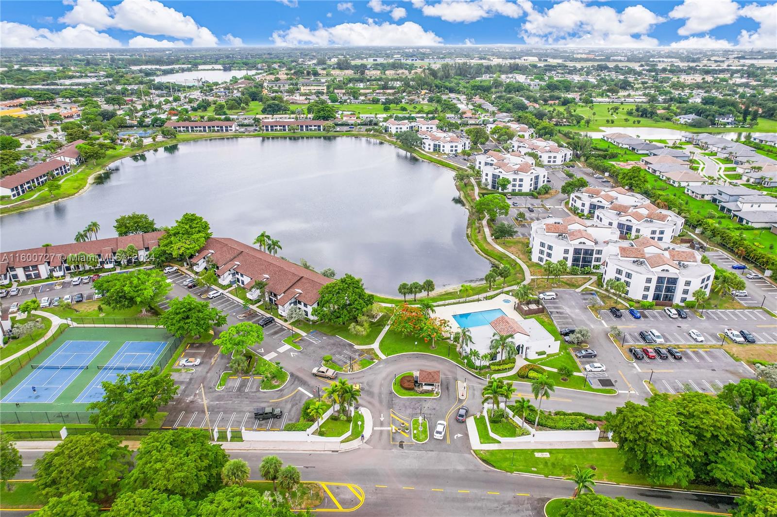 an aerial view of lake residential houses with outdoor space and swimming pool