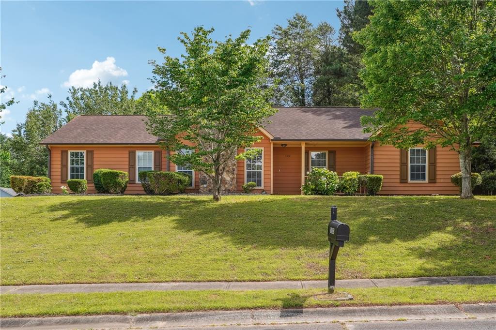 a front view of a house with a yard