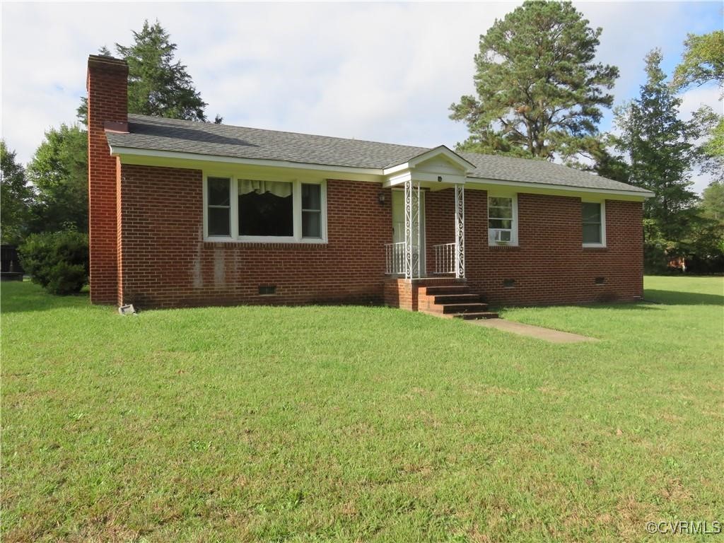 front view of a house with a yard