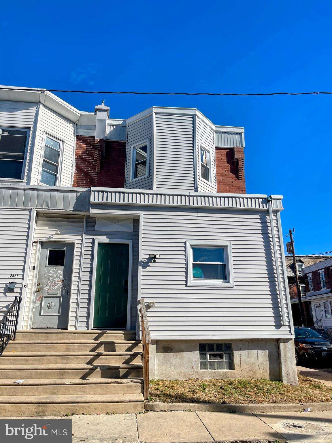 a view of a house with large windows