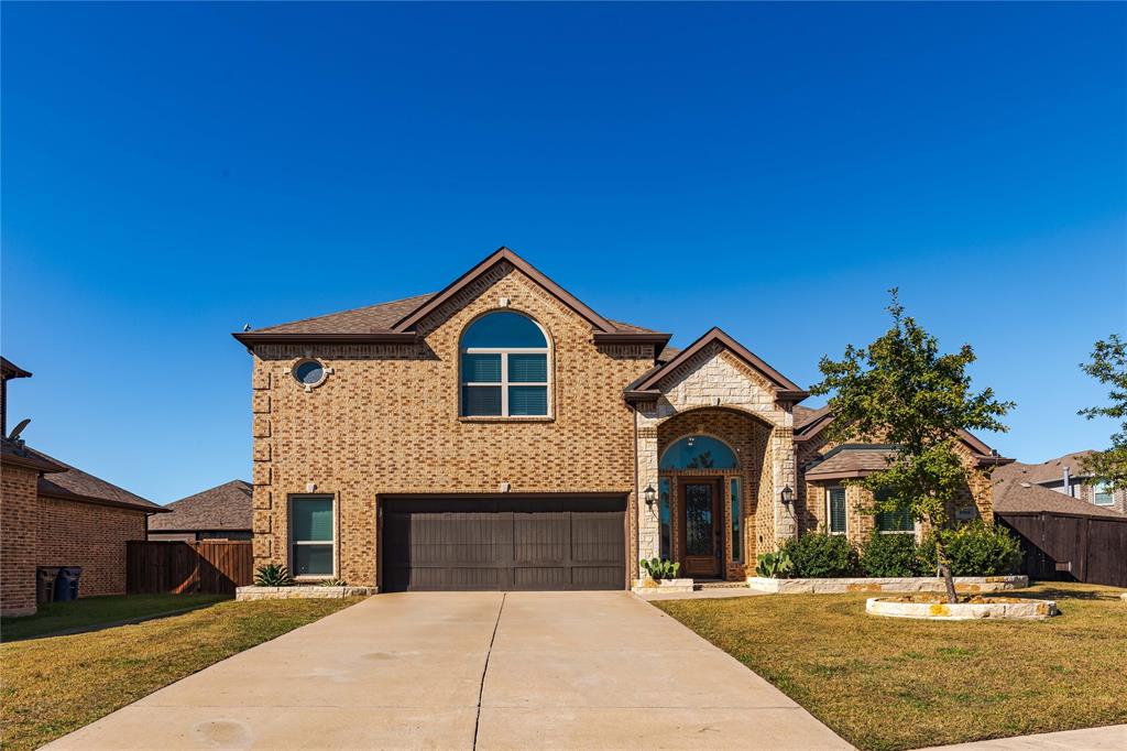 a front view of a house with yard