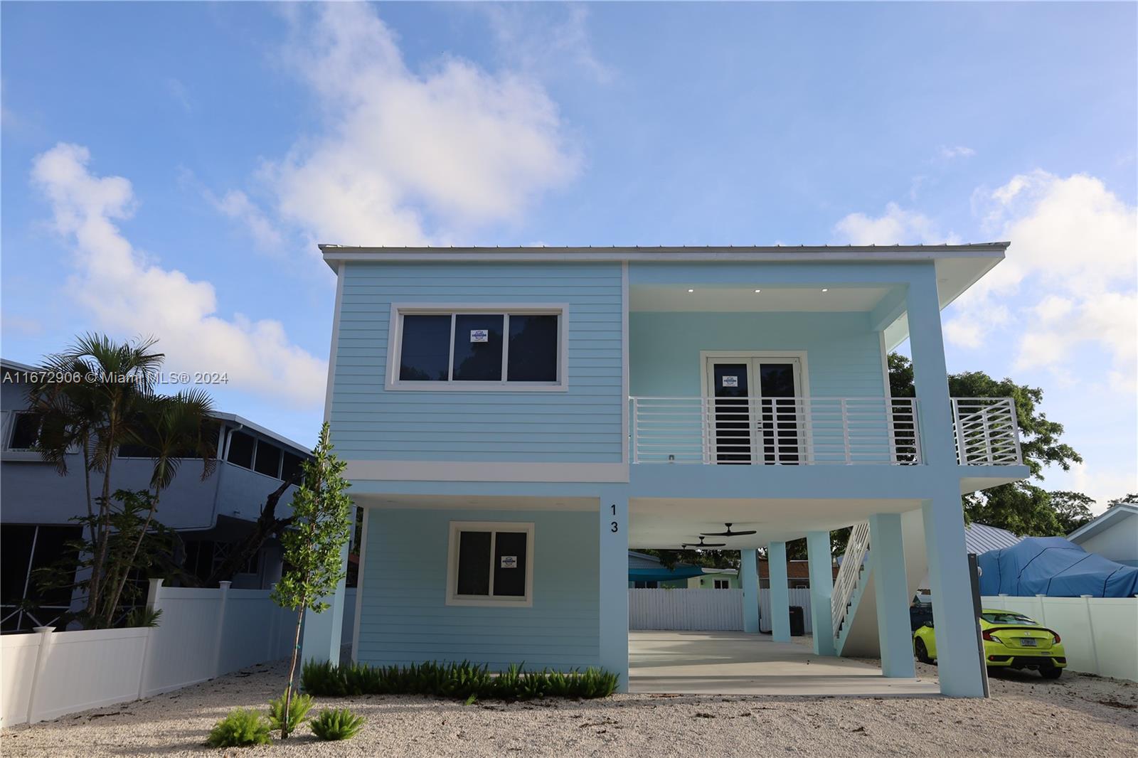 a front view of a house with garage