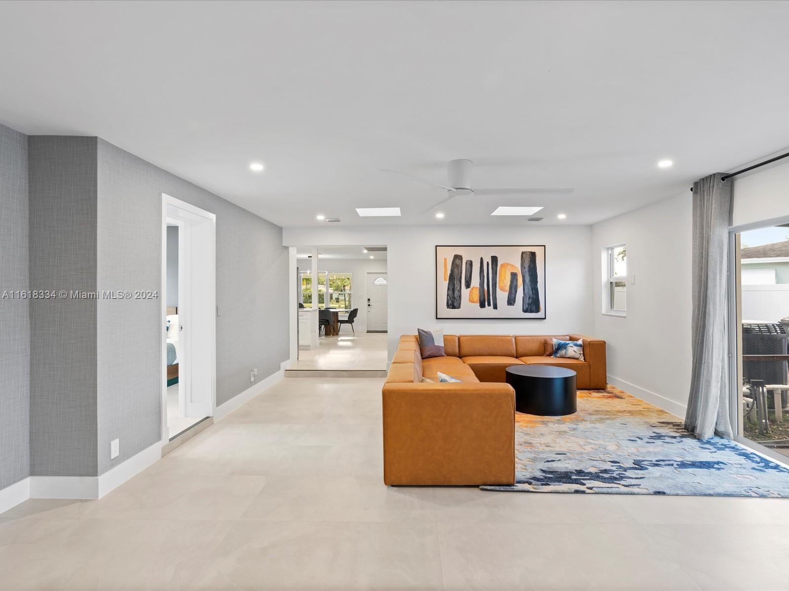 a view of living room filled with furniture and window