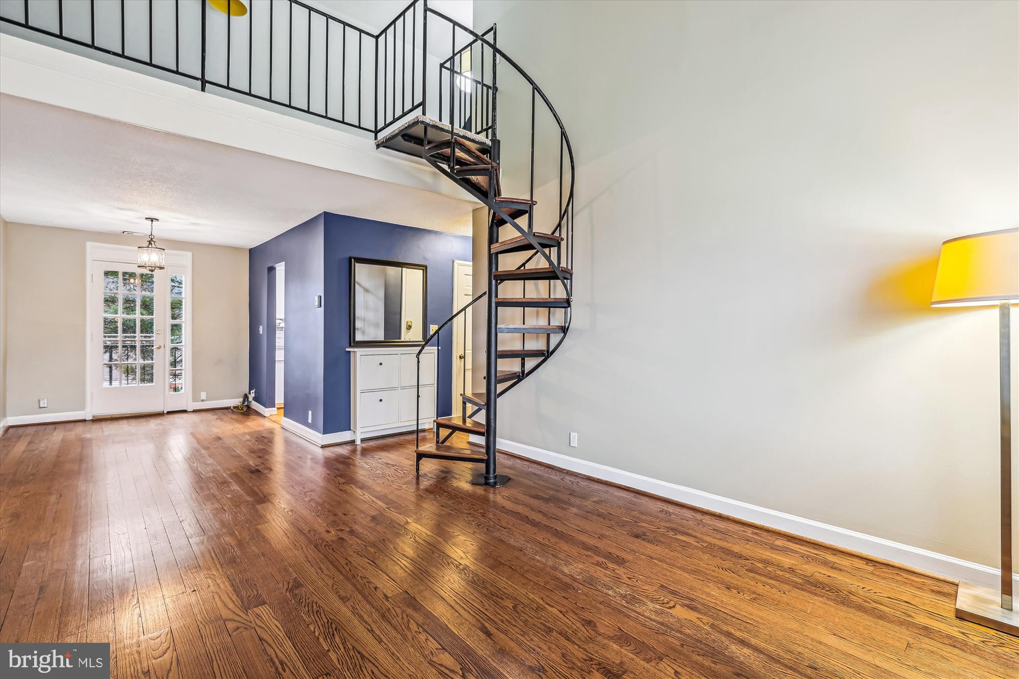 a view of an entryway with wooden floor