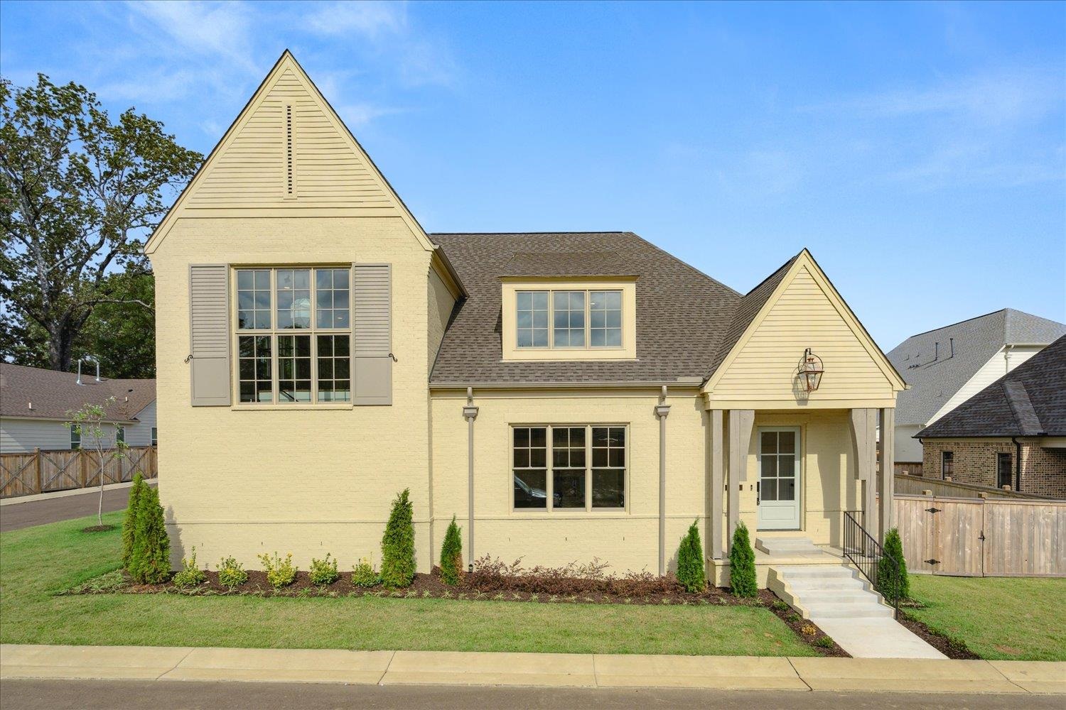 a front view of a house with a yard