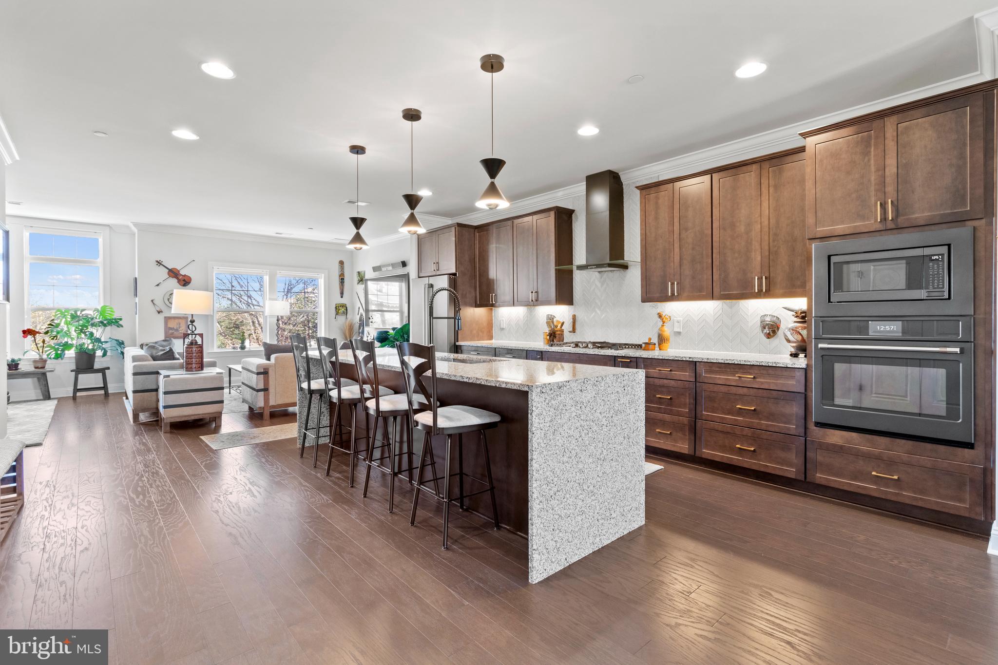 a kitchen that has a lot of cabinets in it and appliances