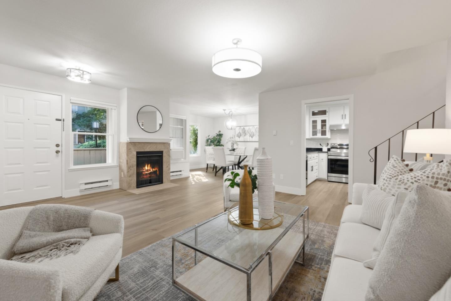 a living room with furniture a fireplace and a fireplace