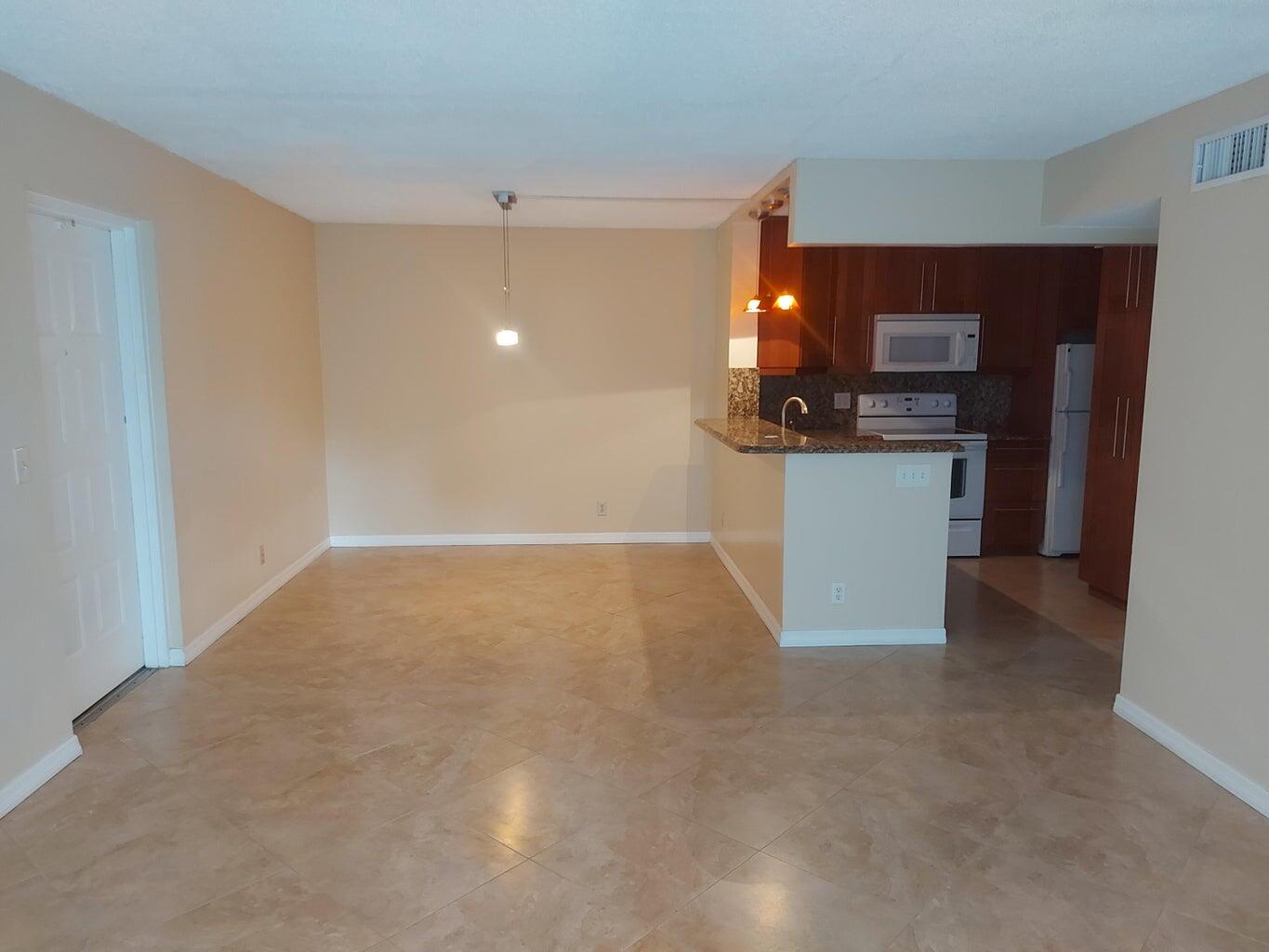 a view of kitchen and front door