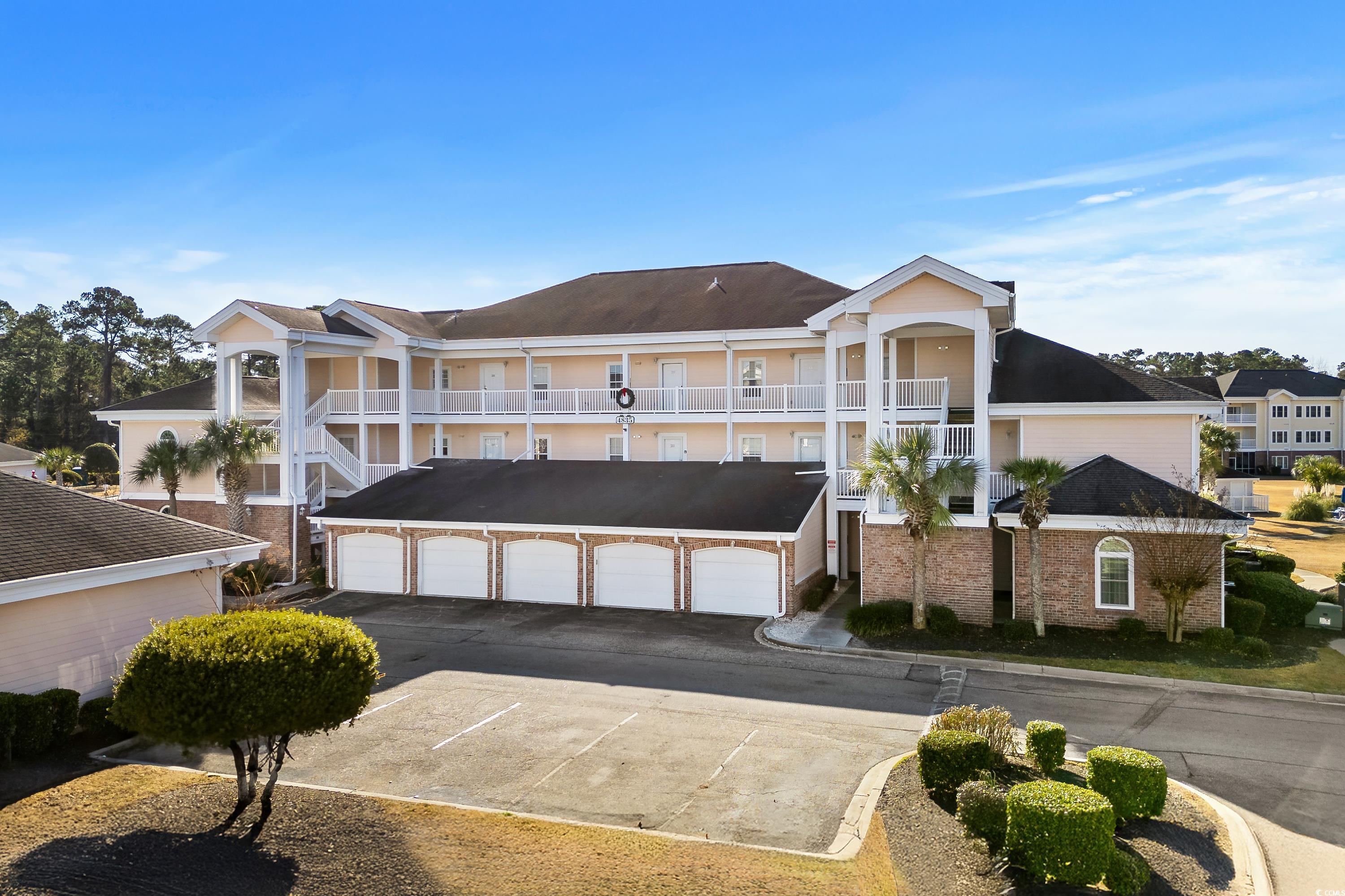 View of front of property featuring a balcony and