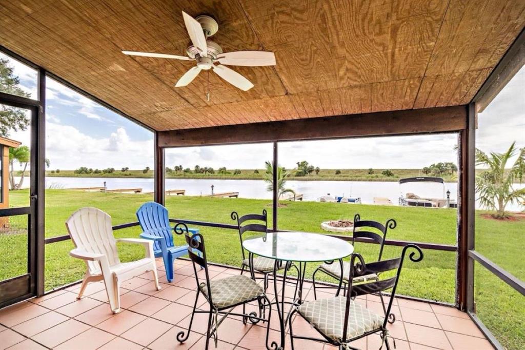 a view of a chairs and table in patio