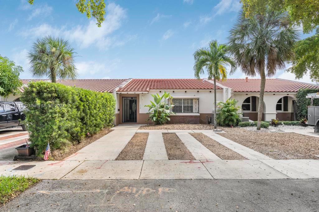 front view of a house with a yard