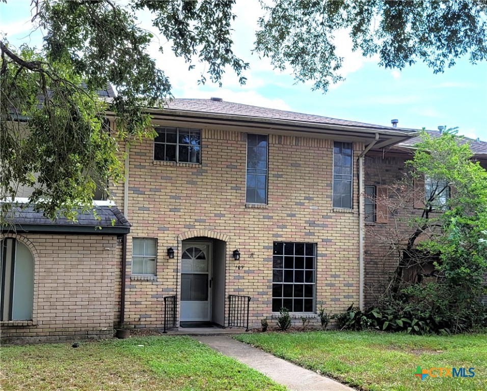 front view of a house with a yard