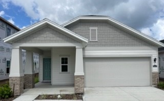 a front view of a house with garage