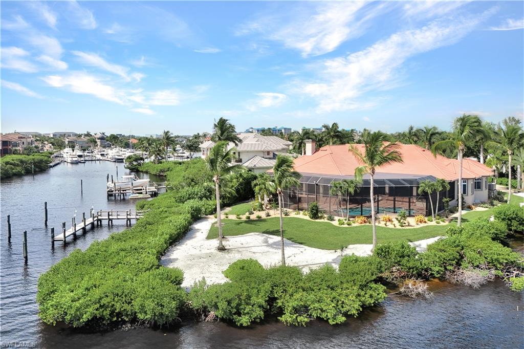 Point lot with over 256 ft of frontage. Endless water views with Private Deeded deepwater dockage for up to 70ft Yacht. Just under an acre of land.