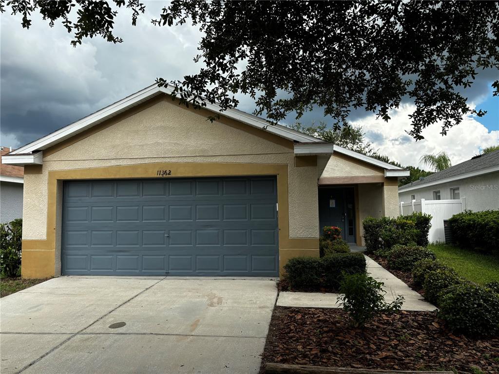 a front view of a house with yard