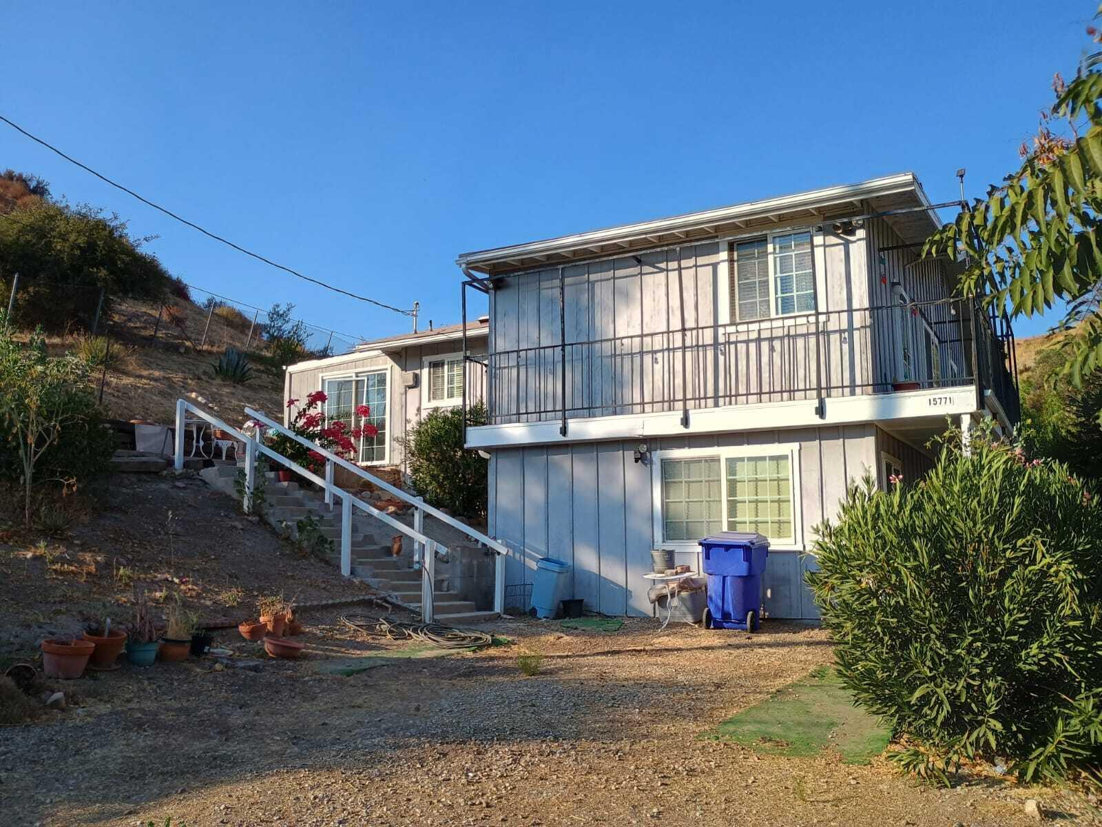 a view of house with yard