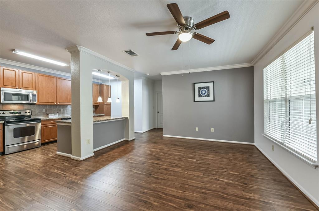 a view of a kitchen with a stove cabinets and wooden floor