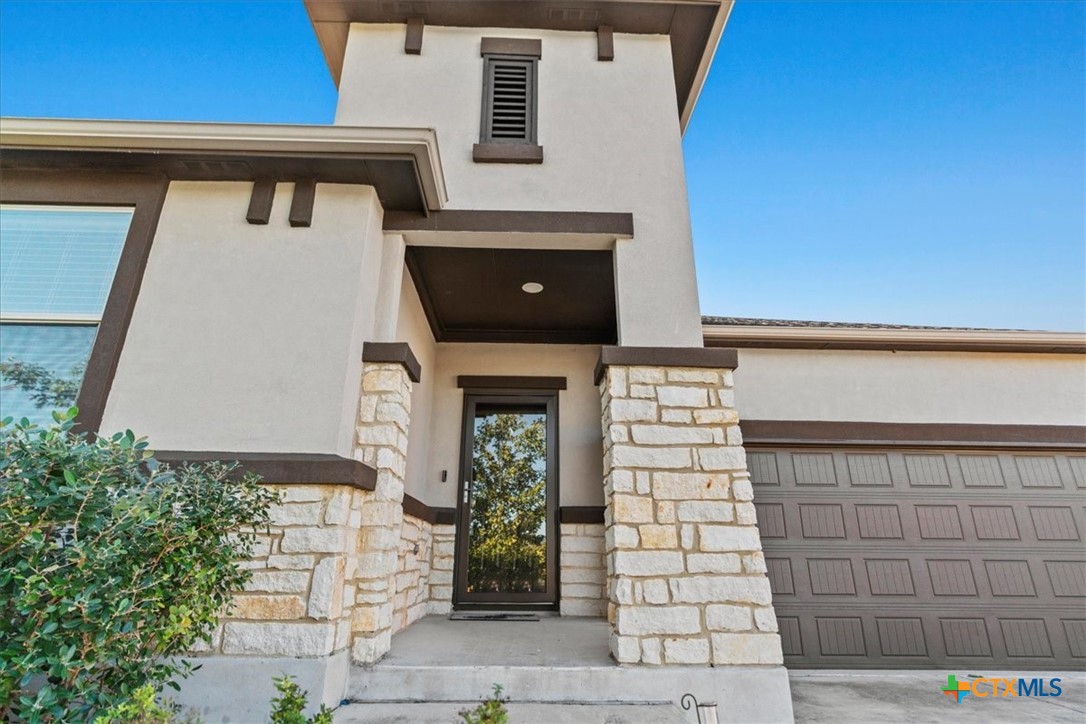 a front view of a house with a garage