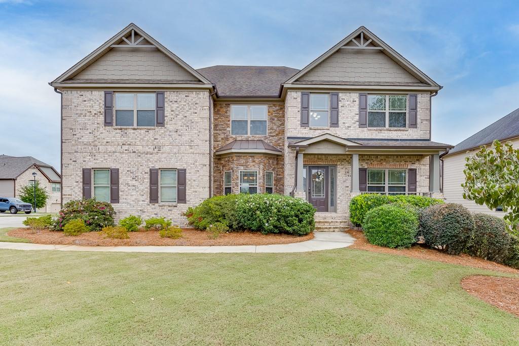 a front view of a house with a yard