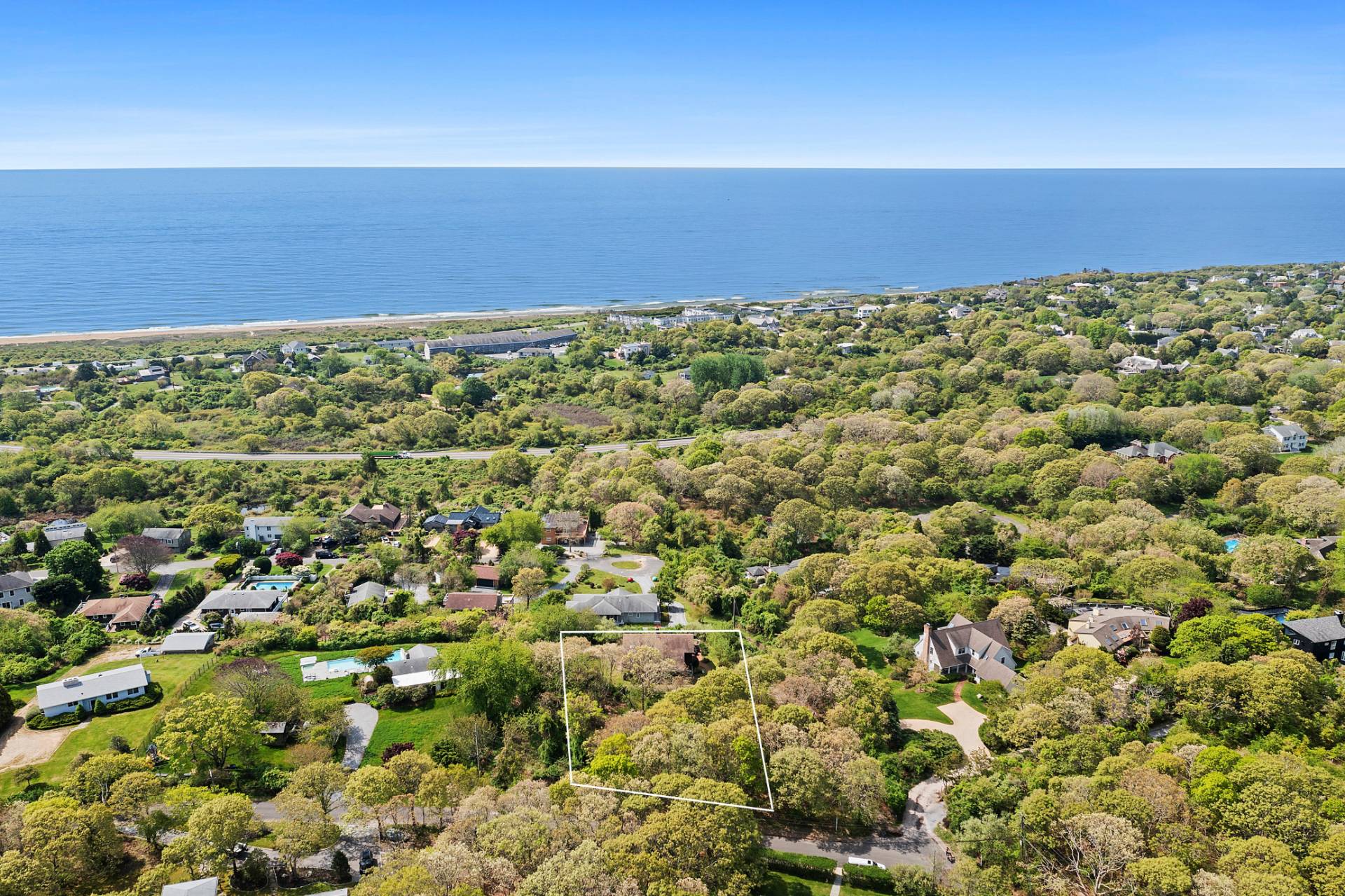 a view of a yard with an ocean