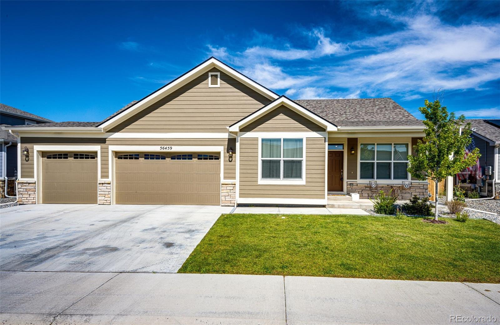 front view of a house with a yard