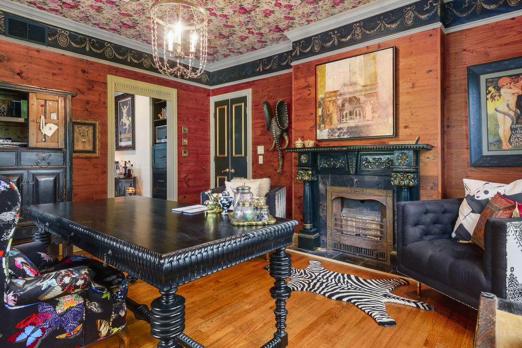 a living room with furniture fireplace and flat screen tv