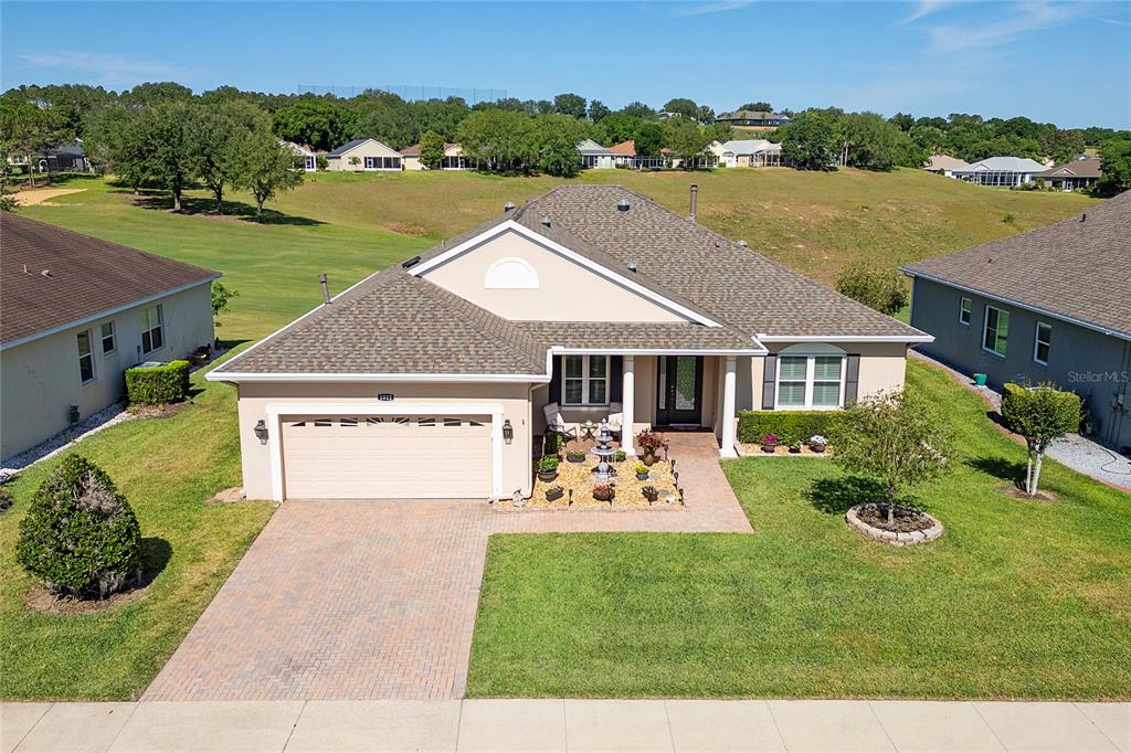 a view of house with outdoor space and lake view