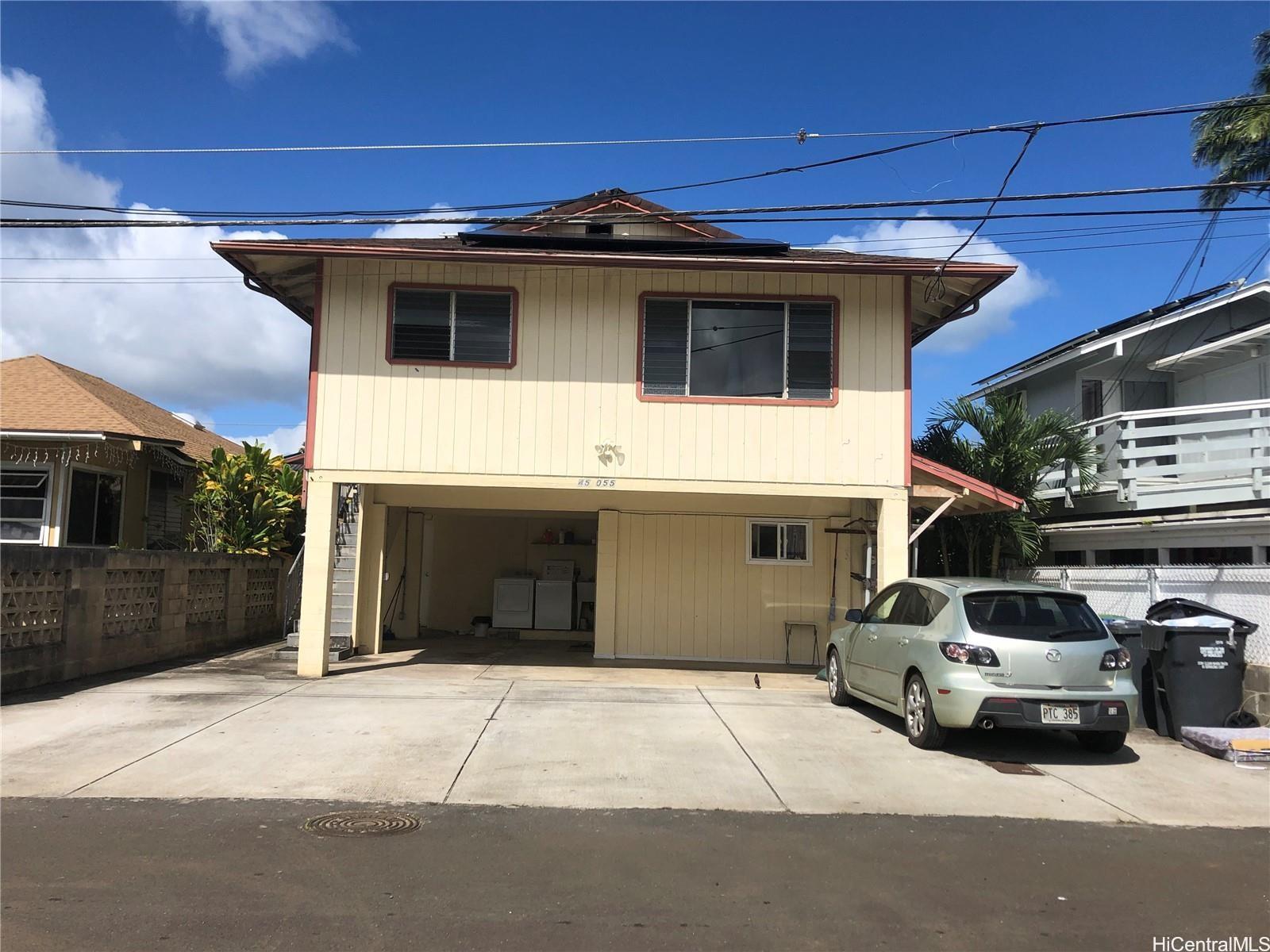 a view of a car garage of the house