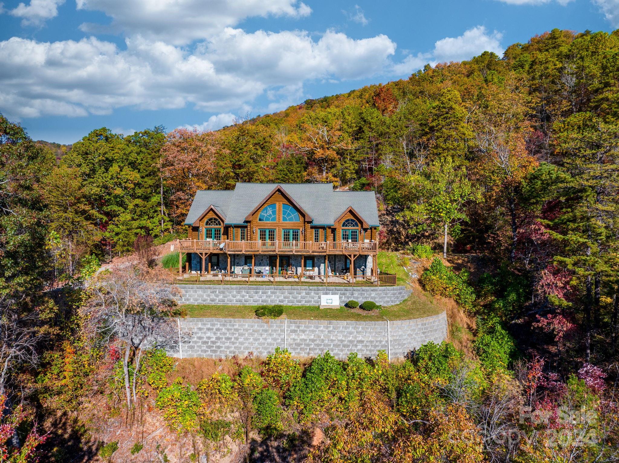 a view of a lake with a house in the background