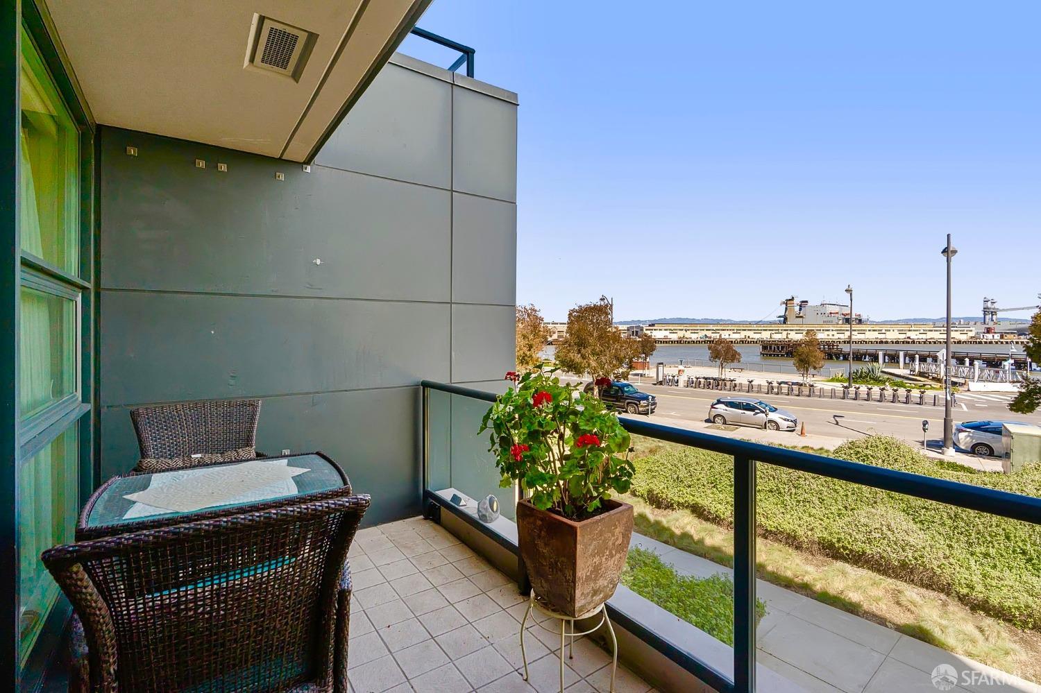 a view of a balcony with chairs