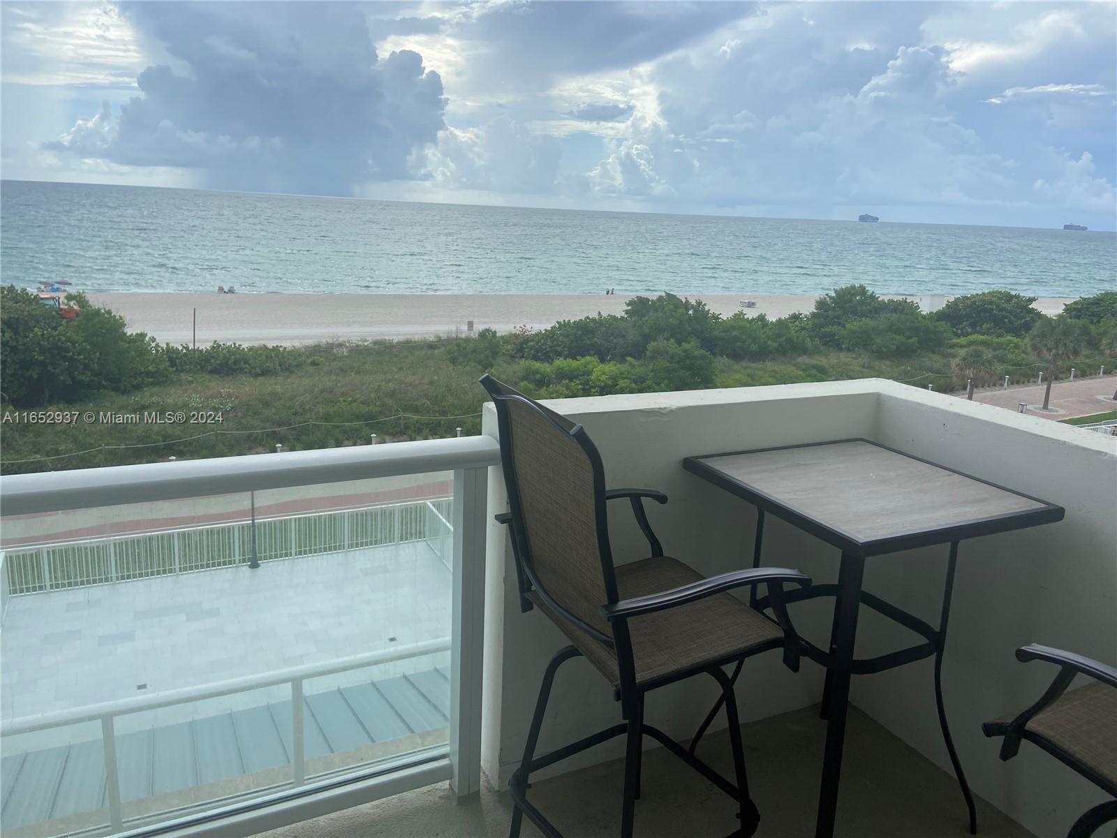 a view of a chairs and table on the terrace