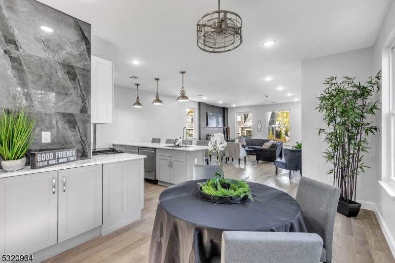 a open kitchen with a table and chairs