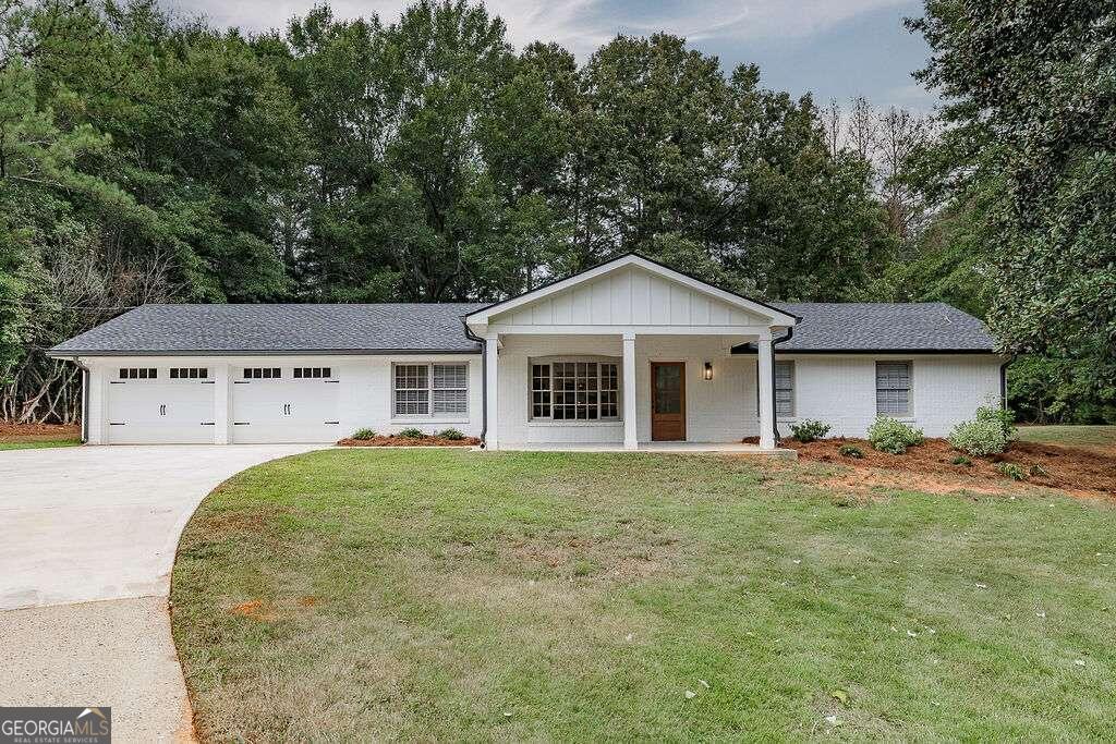 front view of a house with a yard