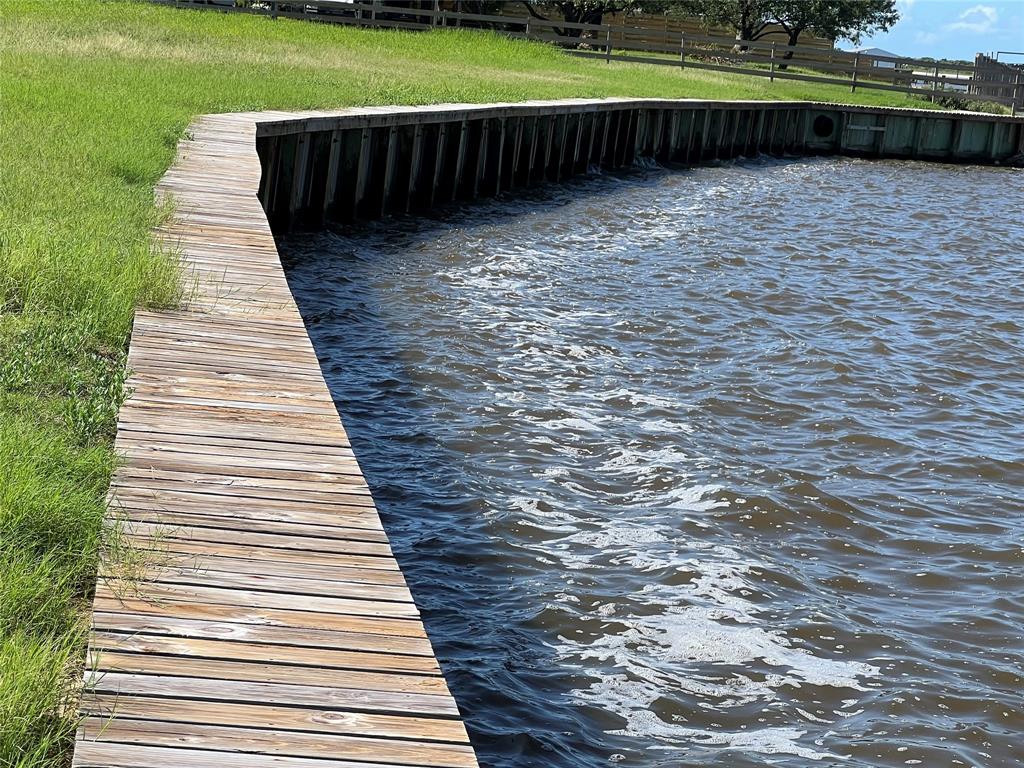 a view of a swimming pool with a yard