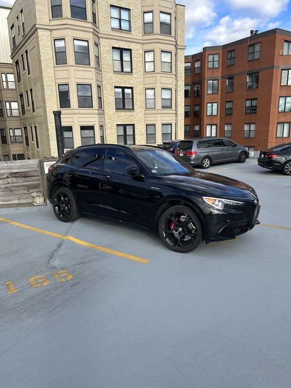 a black car parked in front of a building