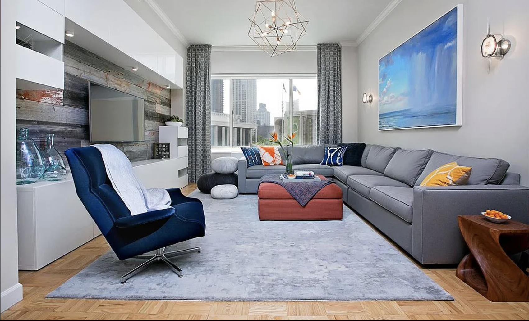 a living room with furniture and a rug