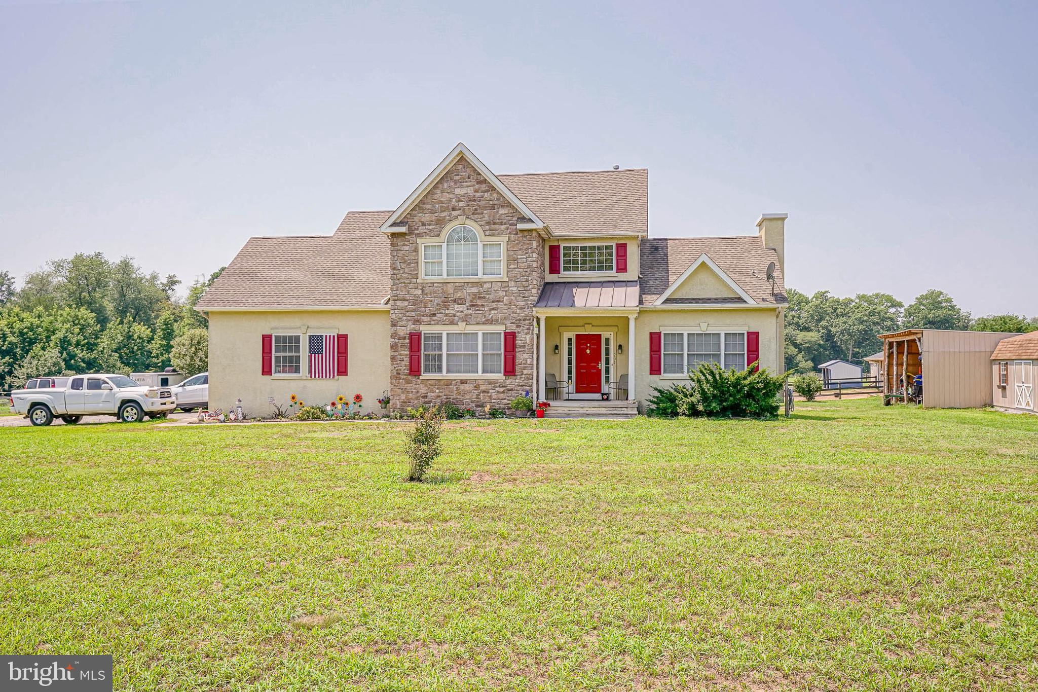 a front view of house with outdoor space and swimming pool