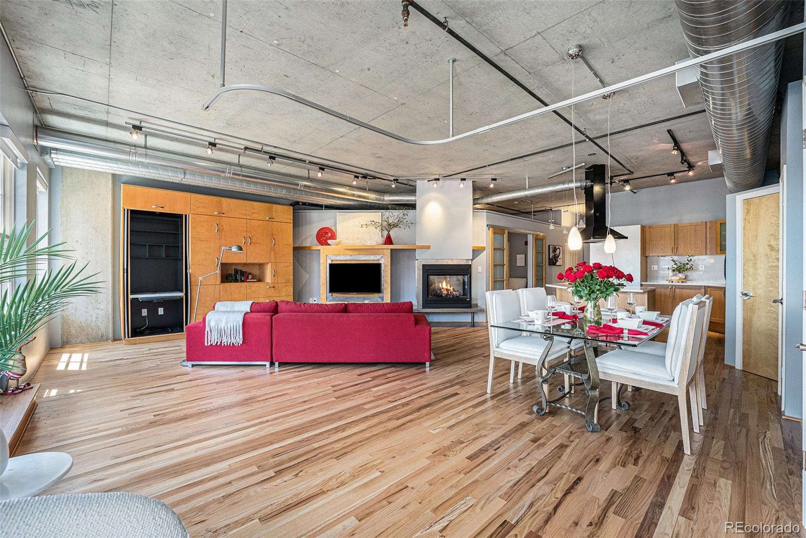 a view of livingroom with furniture fire place and outdoor space