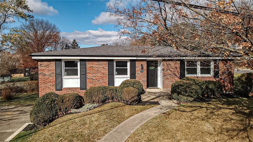 a front view of house with yard outdoor seating