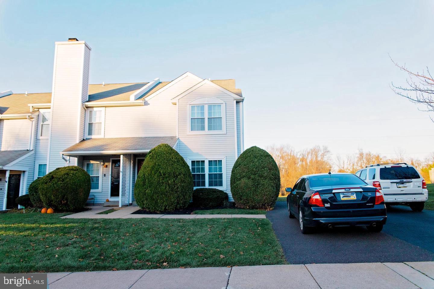 a view of a cars park in front of a house