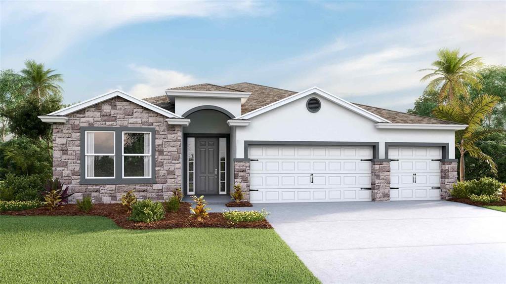 a front view of a house with a yard and garage