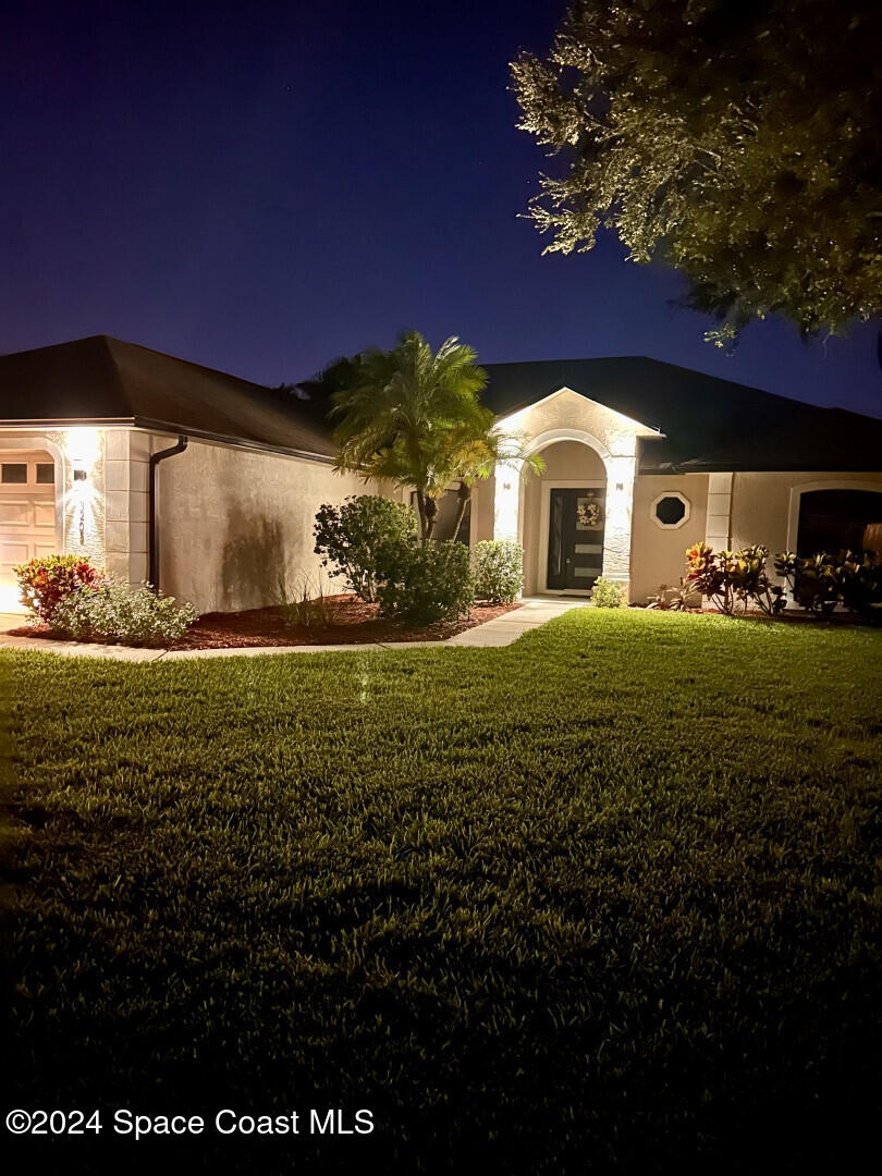 a front view of a house with a yard