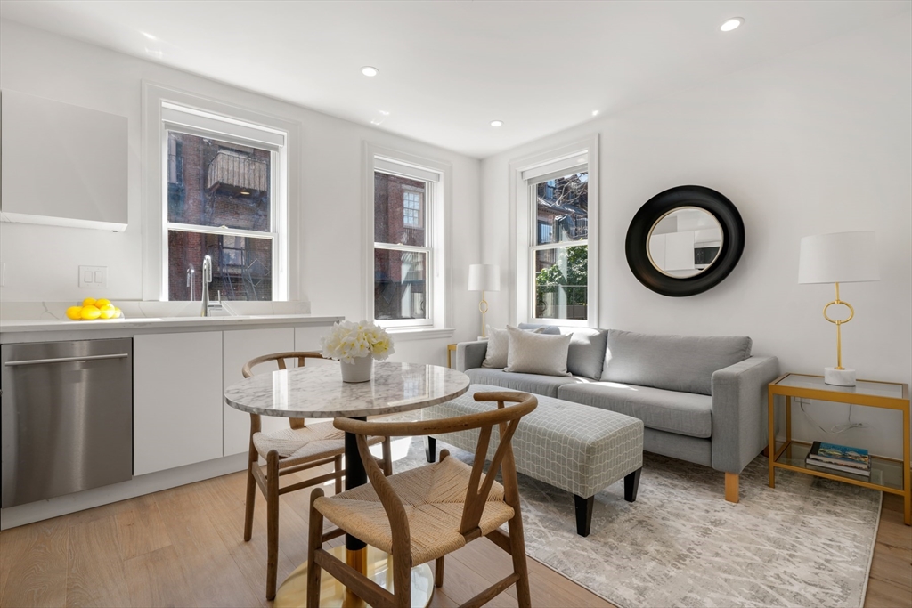 a living room with furniture and window