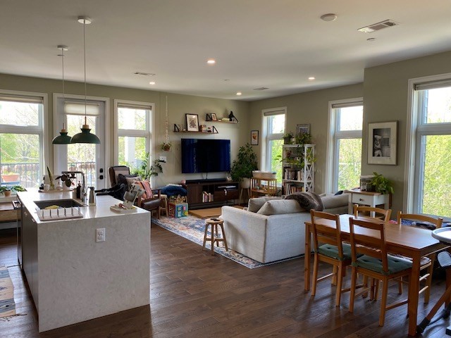 a living room with fireplace furniture and a flat screen tv