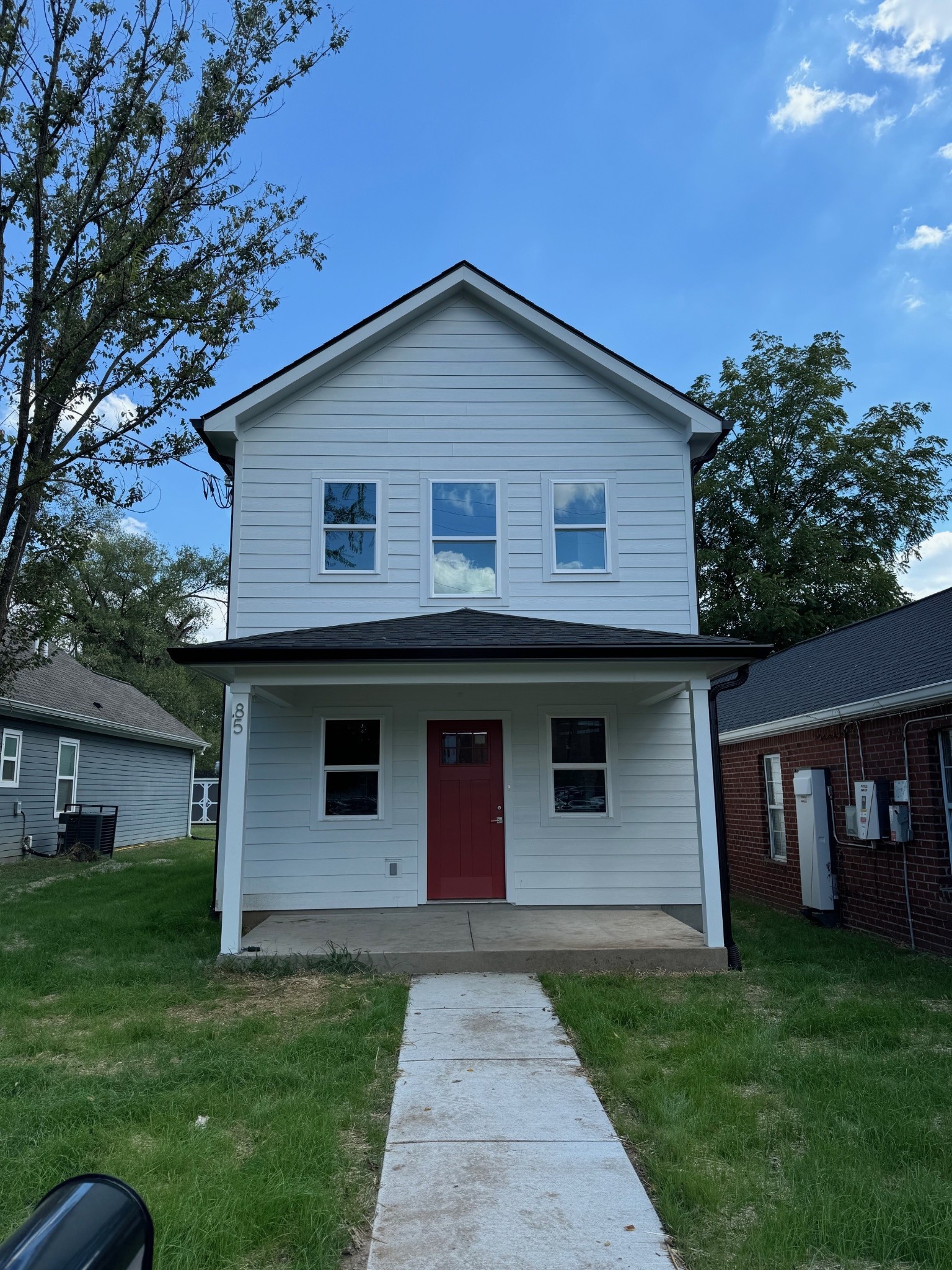 a front view of a house with a yard