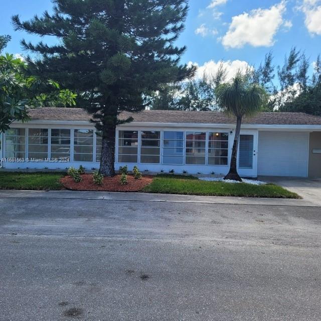 front view of house with a yard