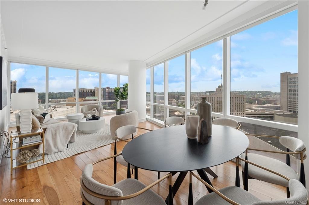 a view of a dining room with furniture window and outside view