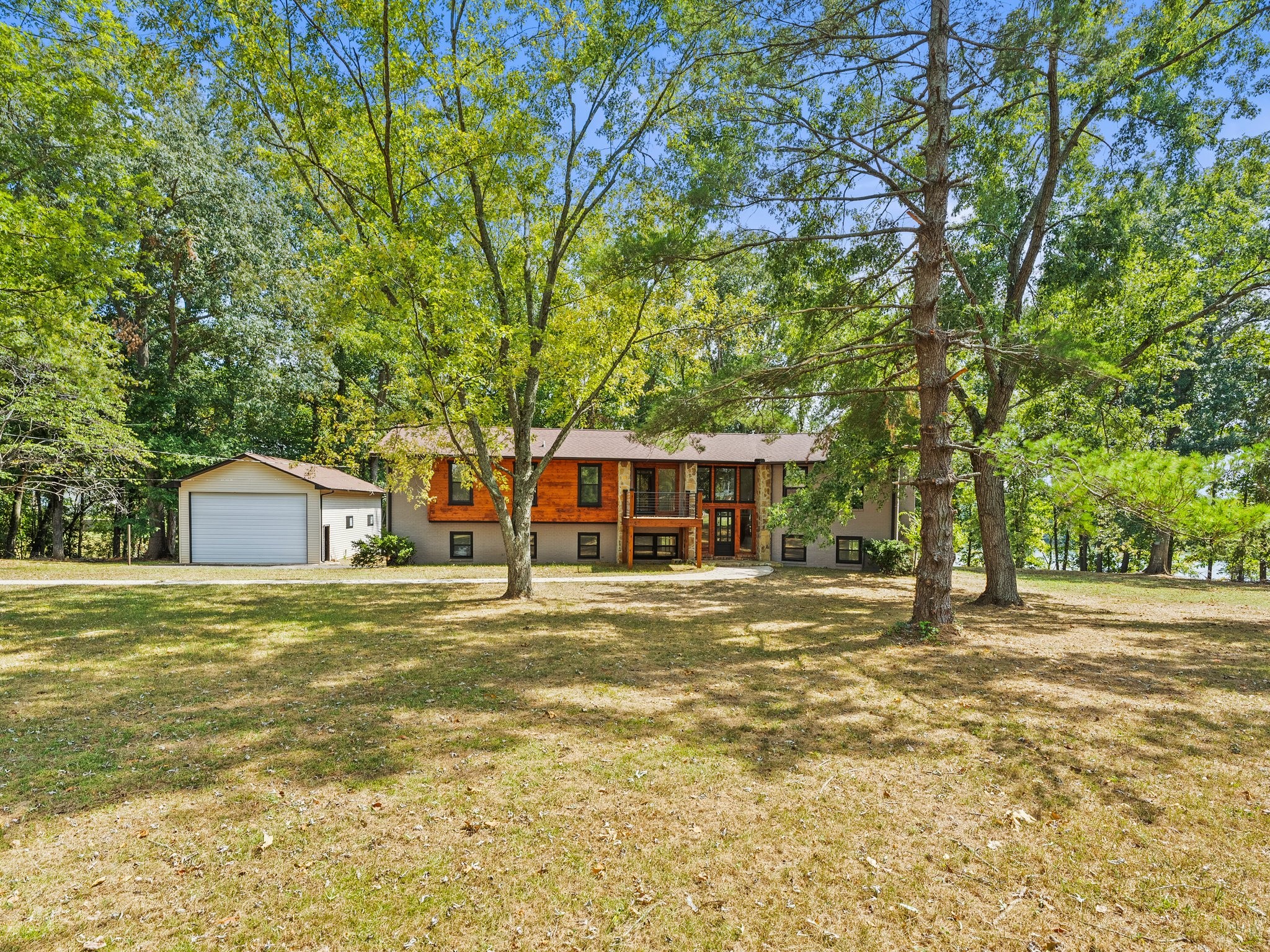 a front view of a house with a garden