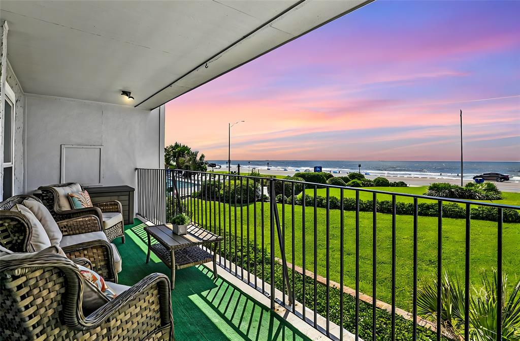 a view of balcony with furniture